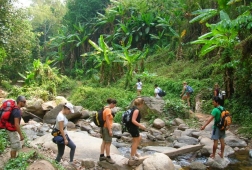 hiking in forest kuang si falls